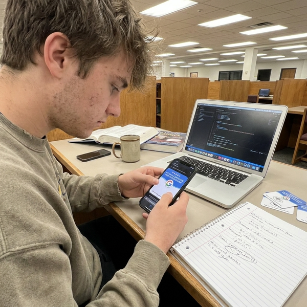 Student programming a review card